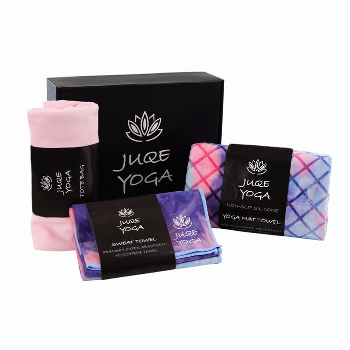 Juqe Yoga Black coloured Gift Box with Juqe Yoga Logo and Lotus flower image. The Gift Box Includes - Premium Tie/Dye Pink Purple and Blue coloured, Non-Slip Silicone and microfibre Yoga Mat Towel,  Matching Sweat Towel and Trendy Pink Tote bag.